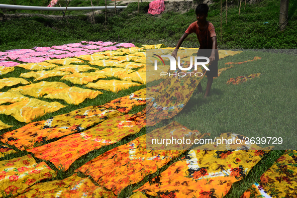 Bangladeshi labors working in the Batik Cloth industry at Narsingdi area near Dhaka, Bangladesh, on April 26, 2018. Each Worker earns par da...