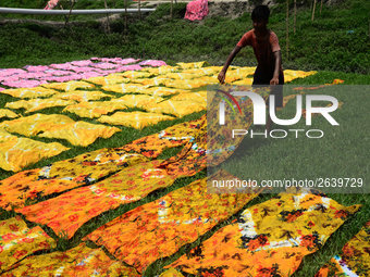 Bangladeshi labors working in the Batik Cloth industry at Narsingdi area near Dhaka, Bangladesh, on April 26, 2018. Each Worker earns par da...