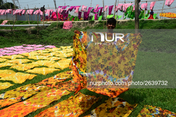 Bangladeshi labors working in the Batik Cloth industry at Narsingdi area near Dhaka, Bangladesh, on April 26, 2018. Each Worker earns par da...