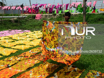 Bangladeshi labors working in the Batik Cloth industry at Narsingdi area near Dhaka, Bangladesh, on April 26, 2018. Each Worker earns par da...