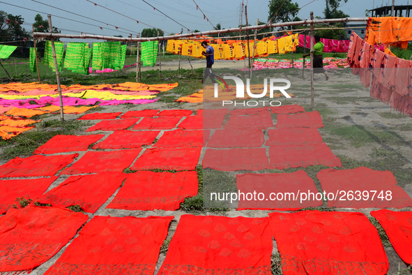 Bangladeshi labors working in the Batik Cloth industry at Narsingdi area near Dhaka, Bangladesh, on April 26, 2018. Each Worker earns par da...