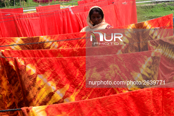 Bangladeshi labors working in the Batik Cloth industry at Narsingdi area near Dhaka, Bangladesh, on April 26, 2018. Each Worker earns par da...