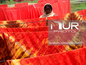 Bangladeshi labors working in the Batik Cloth industry at Narsingdi area near Dhaka, Bangladesh, on April 26, 2018. Each Worker earns par da...