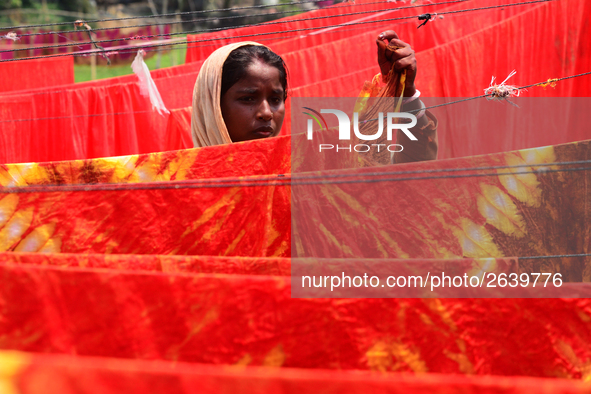 Bangladeshi labors working in the Batik Cloth industry at Narsingdi area near Dhaka, Bangladesh, on April 26, 2018. Each Worker earns par da...