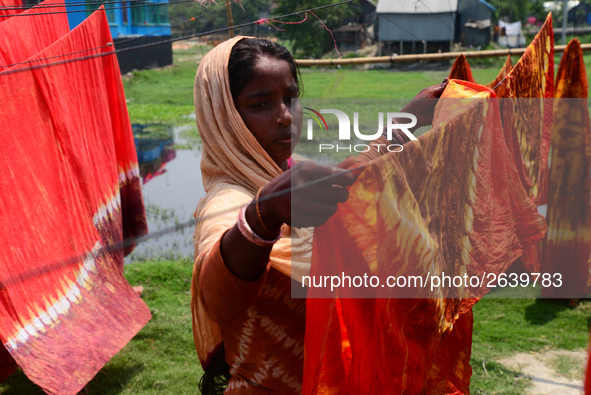 Bangladeshi labors working in the Batik Cloth industry at Narsingdi area near Dhaka, Bangladesh, on April 26, 2018. Each Worker earns par da...