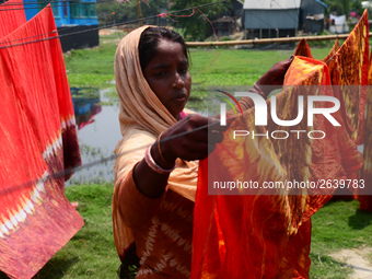 Bangladeshi labors working in the Batik Cloth industry at Narsingdi area near Dhaka, Bangladesh, on April 26, 2018. Each Worker earns par da...