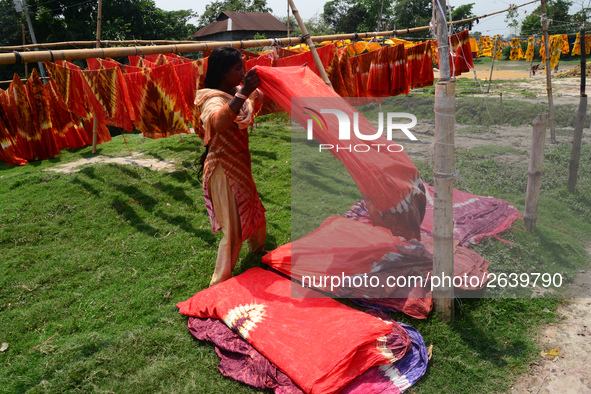 Bangladeshi labors working in the Batik Cloth industry at Narsingdi area near Dhaka, Bangladesh, on April 26, 2018. Each Worker earns par da...