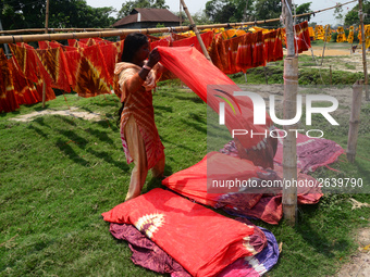 Bangladeshi labors working in the Batik Cloth industry at Narsingdi area near Dhaka, Bangladesh, on April 26, 2018. Each Worker earns par da...