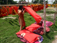 Bangladeshi labors working in the Batik Cloth industry at Narsingdi area near Dhaka, Bangladesh, on April 26, 2018. Each Worker earns par da...