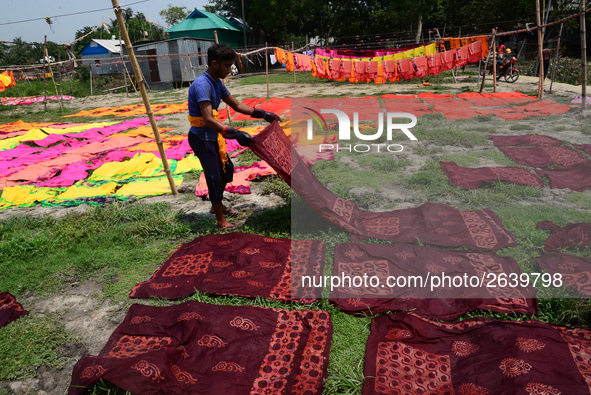 Bangladeshi labors working in the Batik Cloth industry at Narsingdi area near Dhaka, Bangladesh, on April 26, 2018. Each Worker earns par da...