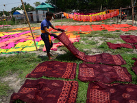 Bangladeshi labors working in the Batik Cloth industry at Narsingdi area near Dhaka, Bangladesh, on April 26, 2018. Each Worker earns par da...