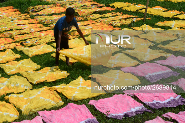 Bangladeshi labors working in the Batik Cloth industry at Narsingdi area near Dhaka, Bangladesh, on April 26, 2018. Each Worker earns par da...