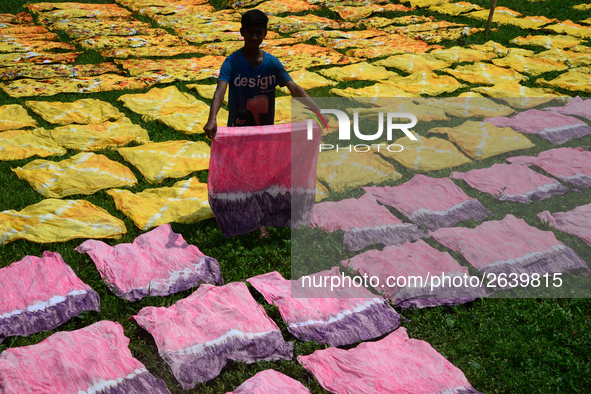 Bangladeshi labors working in the Batik Cloth industry at Narsingdi area near Dhaka, Bangladesh, on April 26, 2018. Each Worker earns par da...