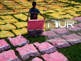 Bangladeshi labors working in the Batik Cloth industry at Narsingdi area near Dhaka, Bangladesh, on April 26, 2018. Each Worker earns par da...