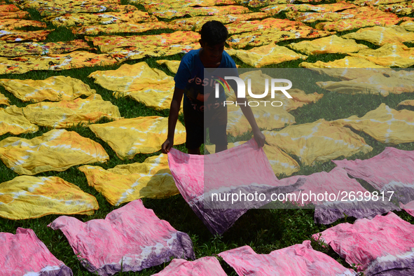 Bangladeshi labors working in the Batik Cloth industry at Narsingdi area near Dhaka, Bangladesh, on April 26, 2018. Each Worker earns par da...