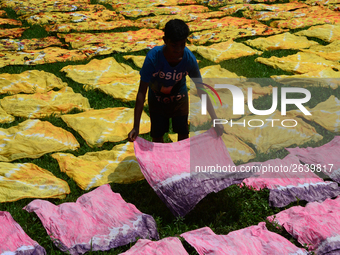 Bangladeshi labors working in the Batik Cloth industry at Narsingdi area near Dhaka, Bangladesh, on April 26, 2018. Each Worker earns par da...