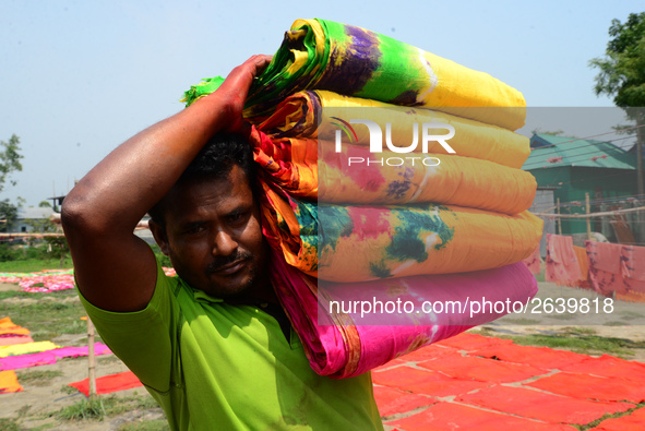 Bangladeshi labors working in the Batik Cloth industry at Narsingdi area near Dhaka, Bangladesh, on April 26, 2018. Each Worker earns par da...