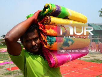 Bangladeshi labors working in the Batik Cloth industry at Narsingdi area near Dhaka, Bangladesh, on April 26, 2018. Each Worker earns par da...