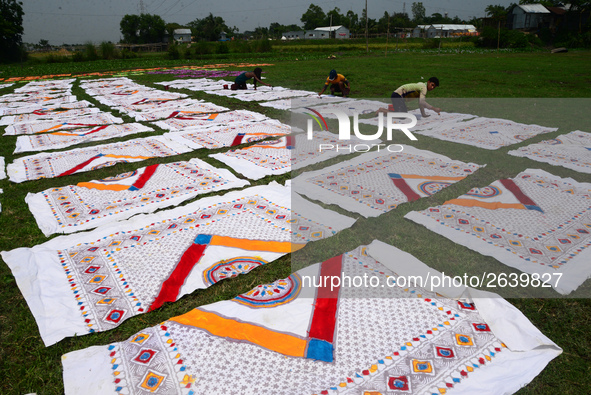 Bangladeshi labors working in the Batik Cloth industry at Narsingdi area near Dhaka, Bangladesh, on April 26, 2018. Each Worker earns par da...