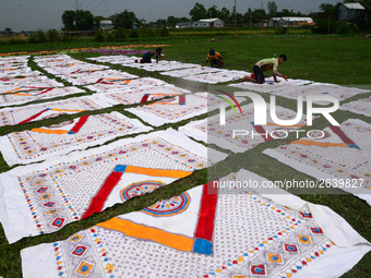 Bangladeshi labors working in the Batik Cloth industry at Narsingdi area near Dhaka, Bangladesh, on April 26, 2018. Each Worker earns par da...