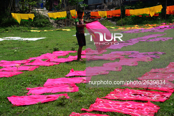 Bangladeshi labors working in the Batik Cloth industry at Narsingdi area near Dhaka, Bangladesh, on April 26, 2018. Each Worker earns par da...