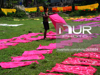 Bangladeshi labors working in the Batik Cloth industry at Narsingdi area near Dhaka, Bangladesh, on April 26, 2018. Each Worker earns par da...