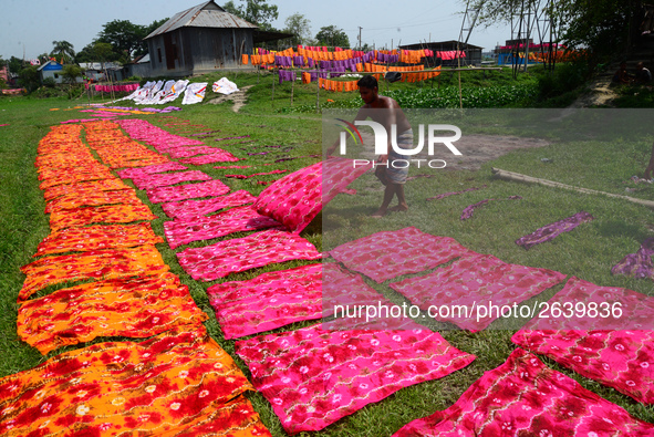 Bangladeshi labors working in the Batik Cloth industry at Narsingdi area near Dhaka, Bangladesh, on April 26, 2018. Each Worker earns par da...