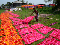 Bangladeshi labors working in the Batik Cloth industry at Narsingdi area near Dhaka, Bangladesh, on April 26, 2018. Each Worker earns par da...