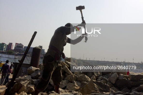  A stone breaking worker is working in a field in a heated mid-summer day on April 27th 2018, in Dhaka, Bangladesh. 