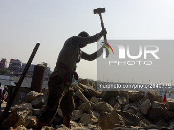  A stone breaking worker is working in a field in a heated mid-summer day on April 27th 2018, in Dhaka, Bangladesh. (