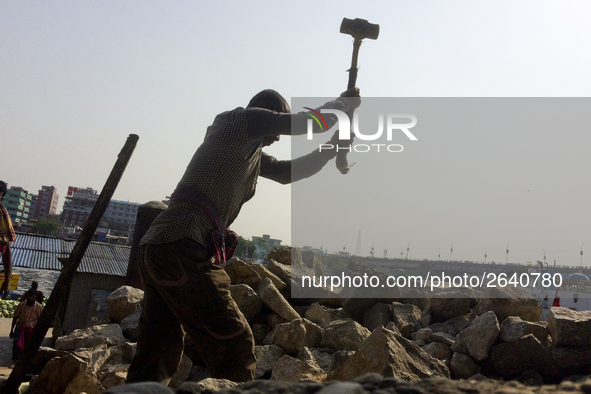  A stone breaking worker is working in a field in a heated mid-summer day on April 27th 2018, in Dhaka, Bangladesh. 