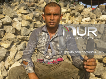  A stone breaking worker is working in a field in a heated mid-summer day on April 27th 2018, in Dhaka, Bangladesh. (