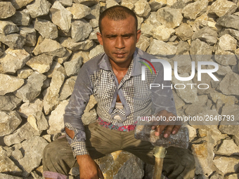  A stone breaking worker is working in a field in a heated mid-summer day on April 27th 2018, in Dhaka, Bangladesh. (