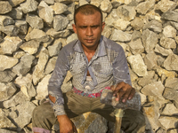  A stone breaking worker is working in a field in a heated mid-summer day on April 27th 2018, in Dhaka, Bangladesh. (