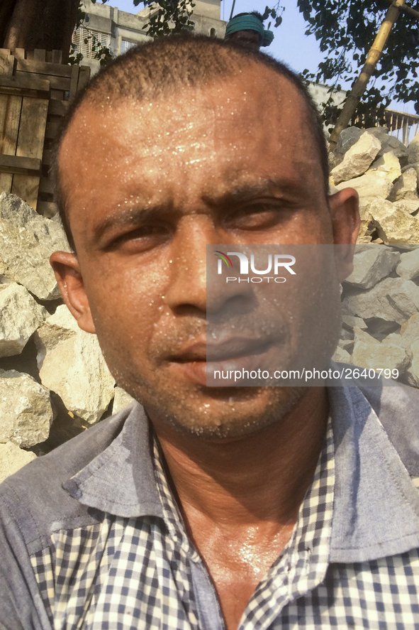  A stone breaking worker is working in a field in a heated mid-summer day on April 27th 2018, in Dhaka, Bangladesh. 