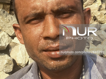  A stone breaking worker is working in a field in a heated mid-summer day on April 27th 2018, in Dhaka, Bangladesh. (