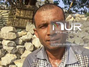  A stone breaking worker is working in a field in a heated mid-summer day on April 27th 2018, in Dhaka, Bangladesh. (