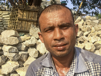  A stone breaking worker is working in a field in a heated mid-summer day on April 27th 2018, in Dhaka, Bangladesh. (