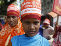 Bangladeshi garment workers take part in a May Day protest rally in Dhaka, Bangladesh on May 01, 2018. Thousands of workers of several occup...