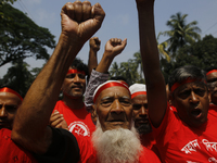 Bangladeshi workers take part in a May Day protest rally in Dhaka, Bangladesh on May 01, 2018. Thousands of workers of several occupations t...