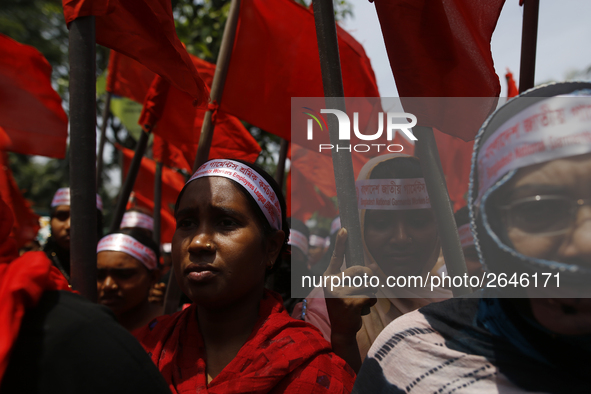 Bangladeshi garment workers take part in a May Day protest rally in Dhaka, Bangladesh on May 01, 2018. Thousands of workers of several occup...