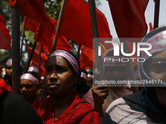 Bangladeshi garment workers take part in a May Day protest rally in Dhaka, Bangladesh on May 01, 2018. Thousands of workers of several occup...