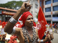 A Bangladeshi worker wears metal chain as he attends a May Day protest rally in Dhaka, Bangladesh on May 01, 2018. Thousands of workers of s...