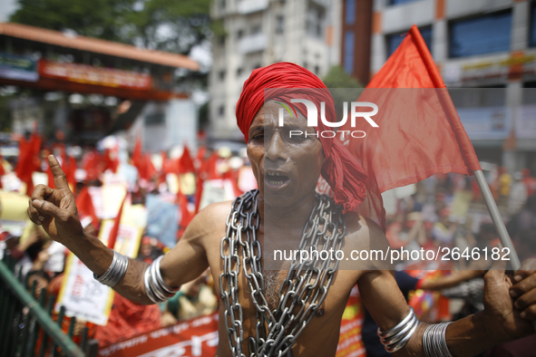 A Bangladeshi worker wears metal chain as he attends a May Day protest rally in Dhaka, Bangladesh on May 01, 2018. Thousands of workers of s...