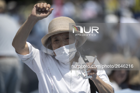 Worker shout slogans during the May Day rally sponsored by the Japanese Trade Union Confederation, known as Rengo at Yoyogi Park in Shibuya...