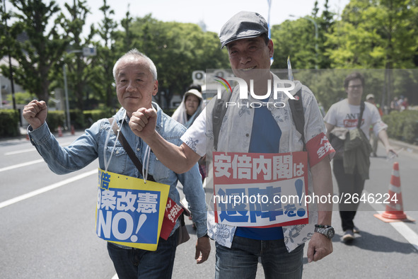 Workers shout slogans during the May Day rally sponsored by the Japanese Trade Union Confederation, known as Rengo at Yoyogi Park in Shibuya...