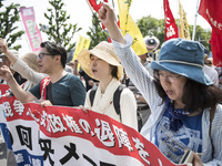 Worker shout slogans during the May Day rally sponsored by the Japanese Trade Union Confederation, known as Rengo at Yoyogi Park in Shibuya...