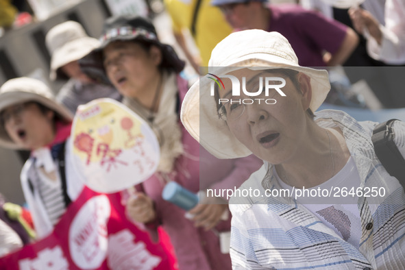 Worker shout slogans during the May Day rally sponsored by the Japanese Trade Union Confederation, known as Rengo at Yoyogi Park in Shibuya...