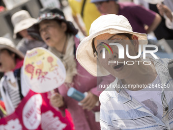 Worker shout slogans during the May Day rally sponsored by the Japanese Trade Union Confederation, known as Rengo at Yoyogi Park in Shibuya...