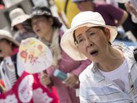 Worker shout slogans during the May Day rally sponsored by the Japanese Trade Union Confederation, known as Rengo at Yoyogi Park in Shibuya...